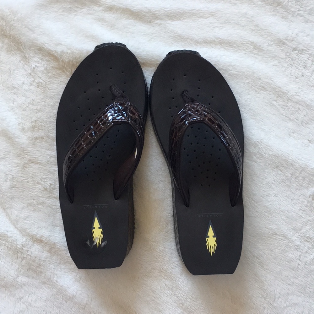 Volatile brown flip flops